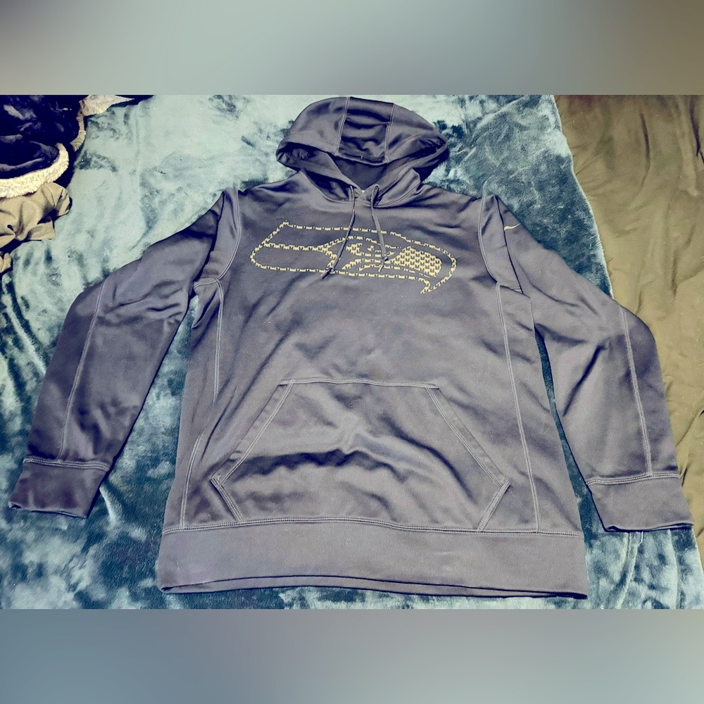 Adult Men’s medium Navy blue Seahawks hoodie.